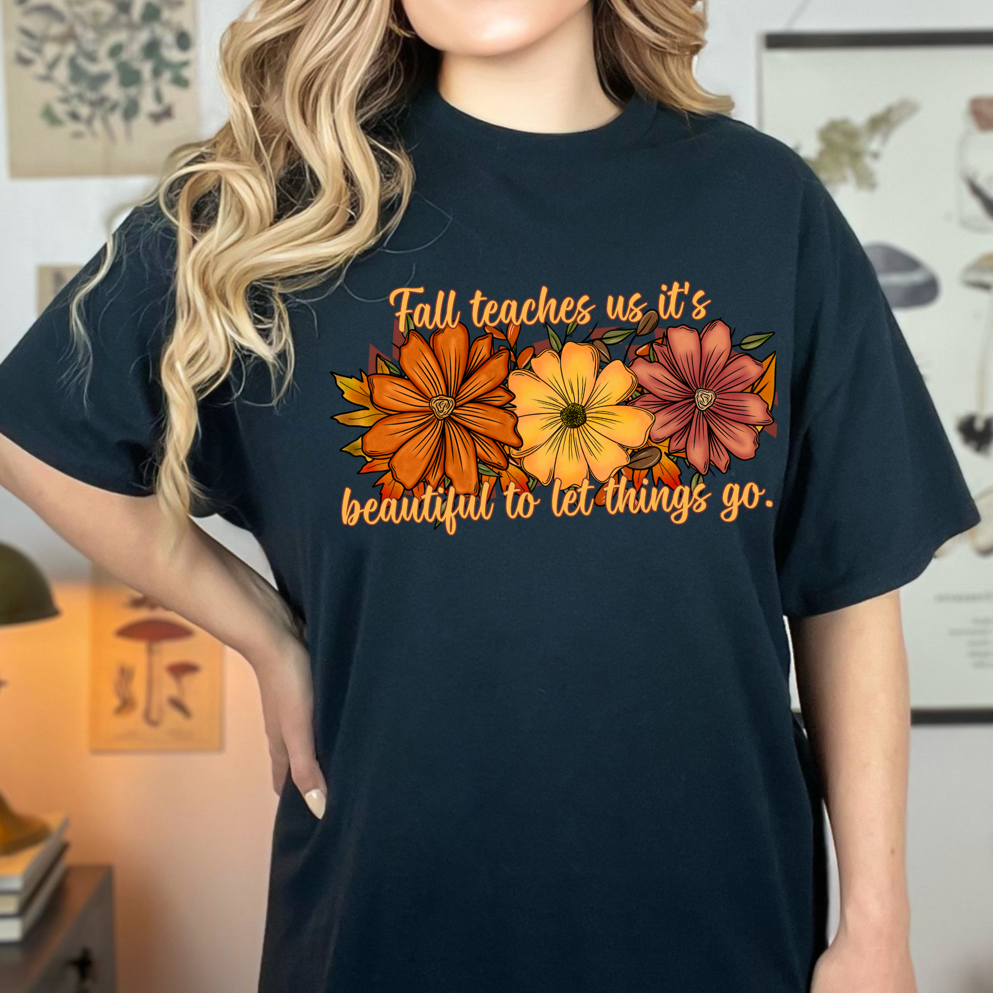 Fall teaches us it’s beautiful to let things go T-shirt, shown on black