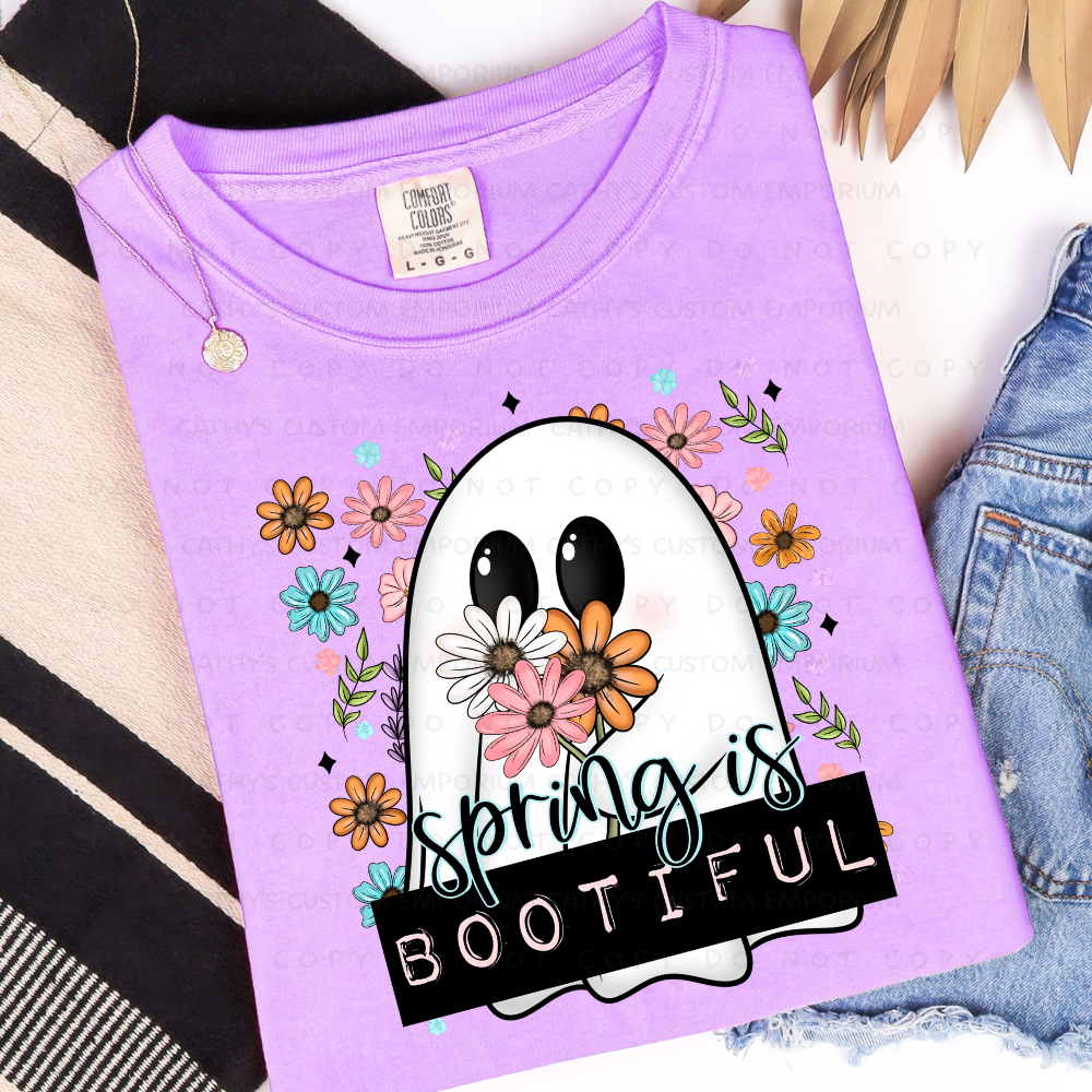 Spring Is Bootiful ghost graphic T-shirt with flowers shown on Comfort Colors Neon Violet