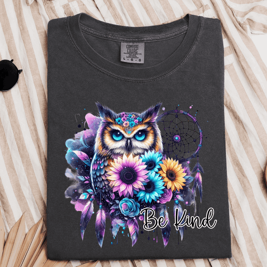 Comfort Colors Pepper graphic T-shirt featuring a colorful owl, flowers, feathers, dreamcatcher, and Be Kind message.