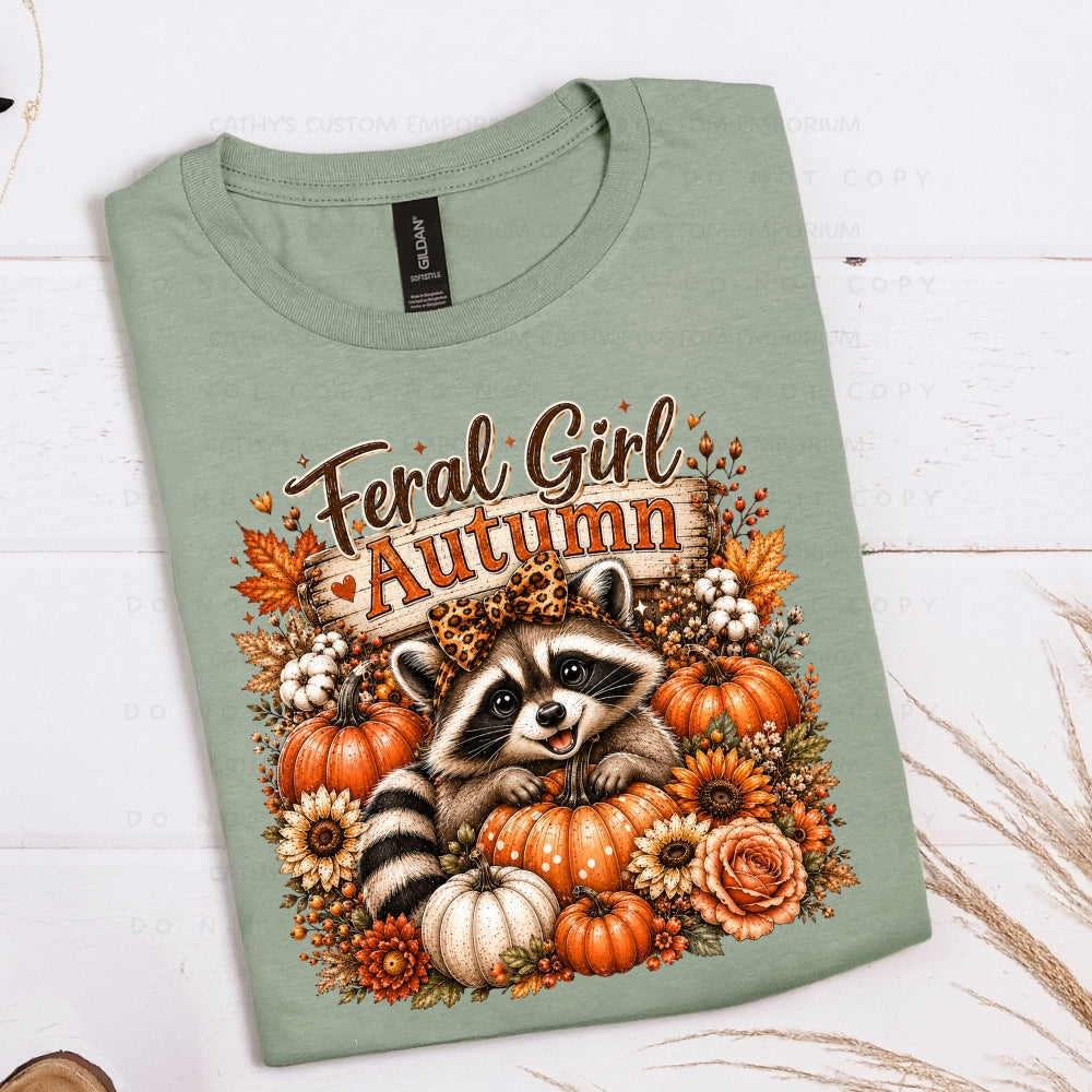 Feral Girl Autumn raccoon graphic with pumpkins and fall flowers