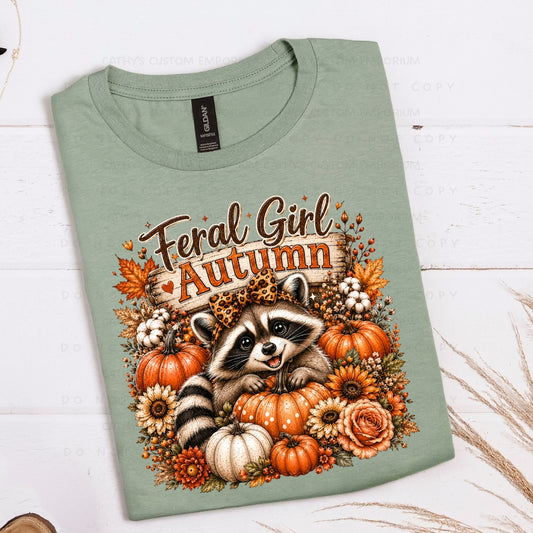 Feral Girl Autumn raccoon graphic with pumpkins and fall flowers