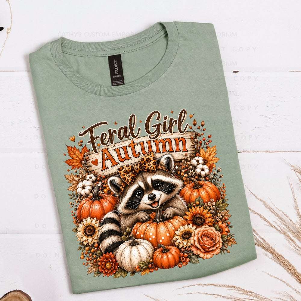 Feral Girl Autumn raccoon graphic with pumpkins and fall flowers