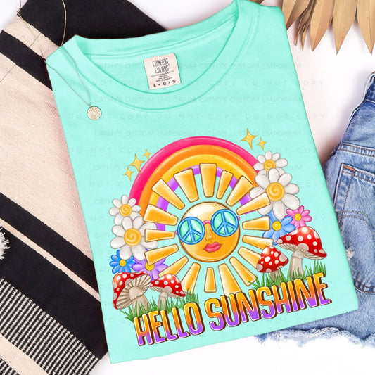 Comfort Colors Island Reef t-shirt with a colorful design featuring a sun, flowers, and mushrooms on a white background.
