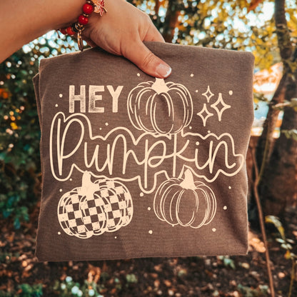 Hey Pumpkin graphic apparel featuring a vintage pickup truck filled with pumpkins and fall accents shown on a Comfort Colors Espresso