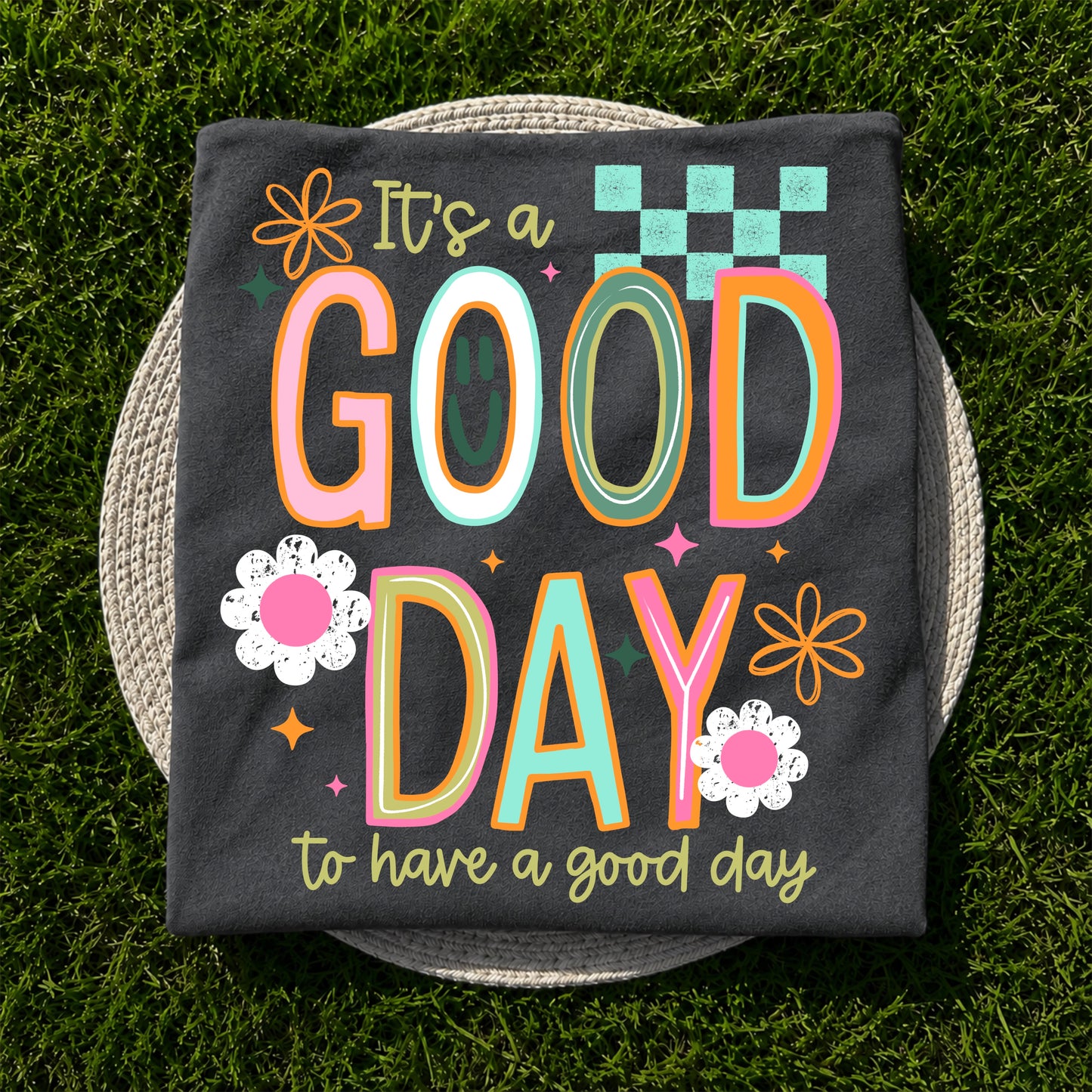 It's a Good Day to Have a Good Day graphic apparel on Comfort Colors Pepper featuring colorful retro lettering and floral accents.
