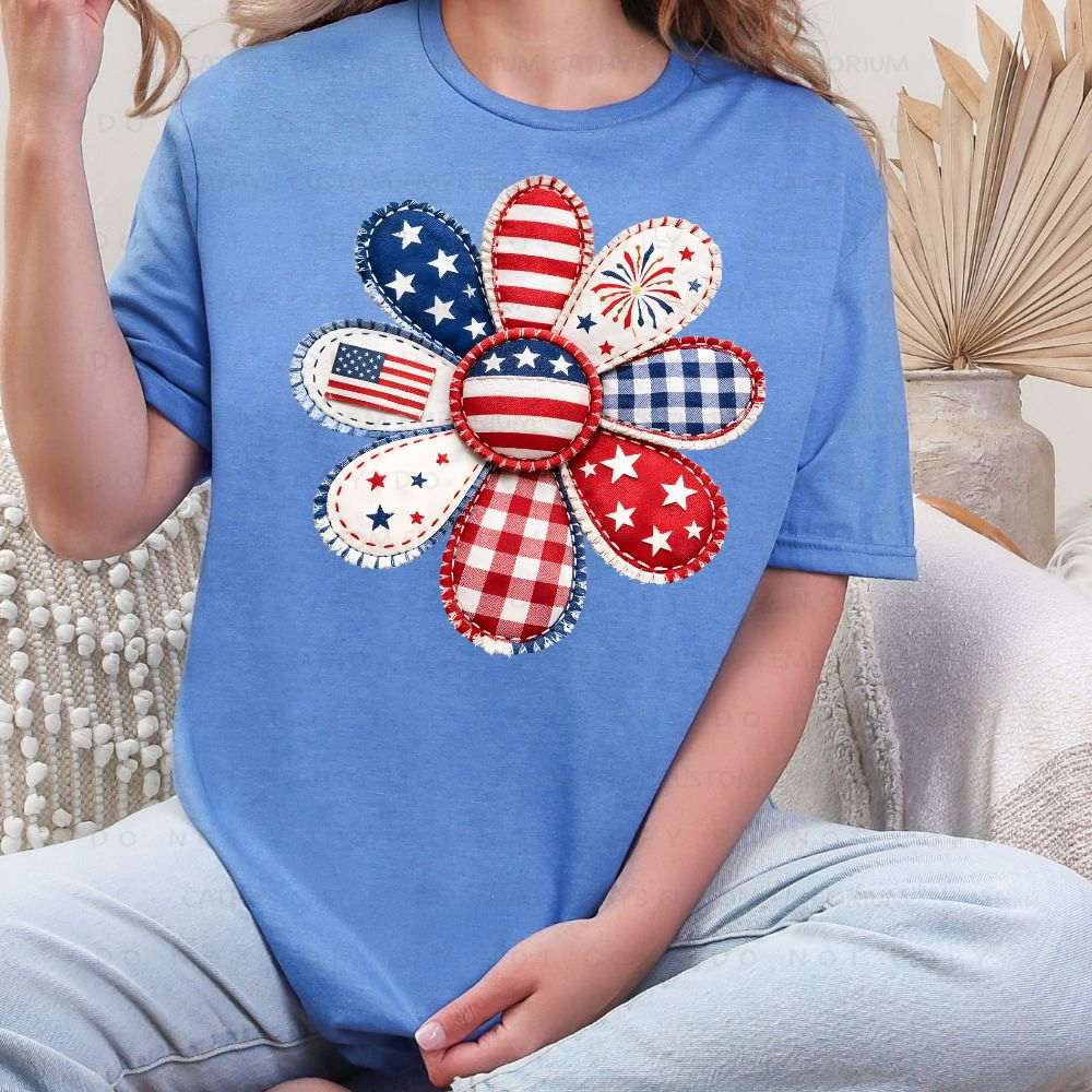 Blue patriotic graphic T-shirt with red white and blue patchwork flower design