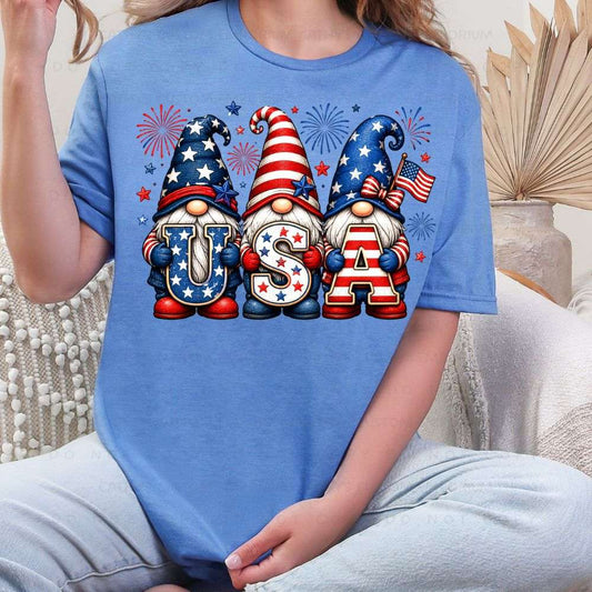Person wearing a blue t-shirt with USA-themed gnomes and fireworks.