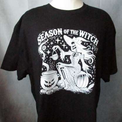 White ink graphic of a witch with a cauldron. Season of the witch writing. T-Shirt, hoodie, or crewneck sweatshirt