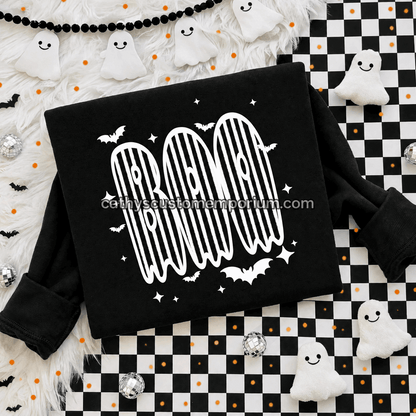 Black BOO Halloween sweatshirt with white striped ghost lettering and bat accents on a checkered flat lay