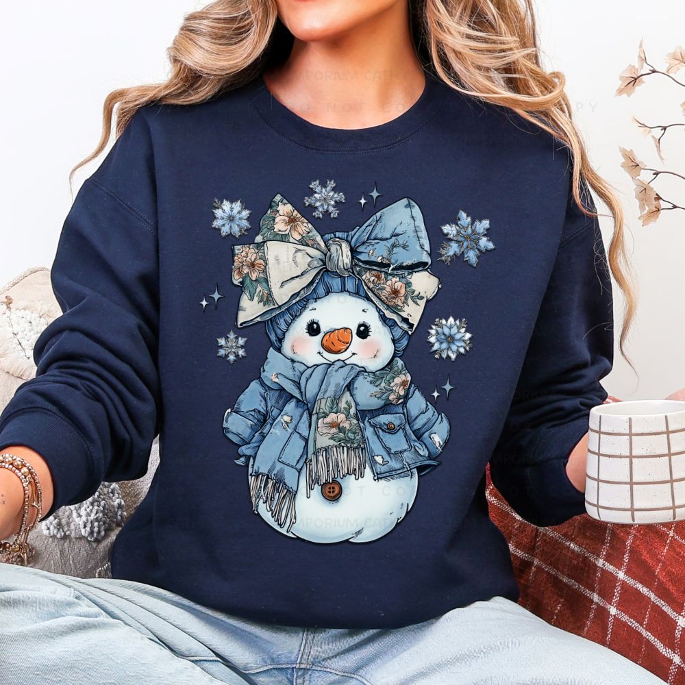 Cozy floral snowman winter graphic sweatshirt with blue bow, scarf, and snowflakes