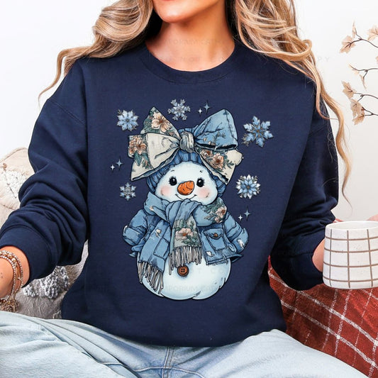 Cozy floral snowman winter graphic sweatshirt with blue bow, scarf, and snowflakes