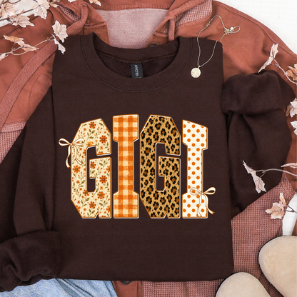 Brown sweatshirt featuring GIGI in floral, orange plaid, leopard print, and polka dot fall patterns