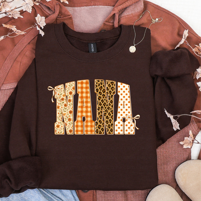 Brown sweatshirt featuring NANA in floral, orange plaid, leopard print, and polka dot fall patterns