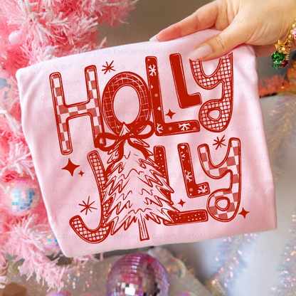 Red retro Holly Jolly Christmas tree graphic shown on a light pink garment