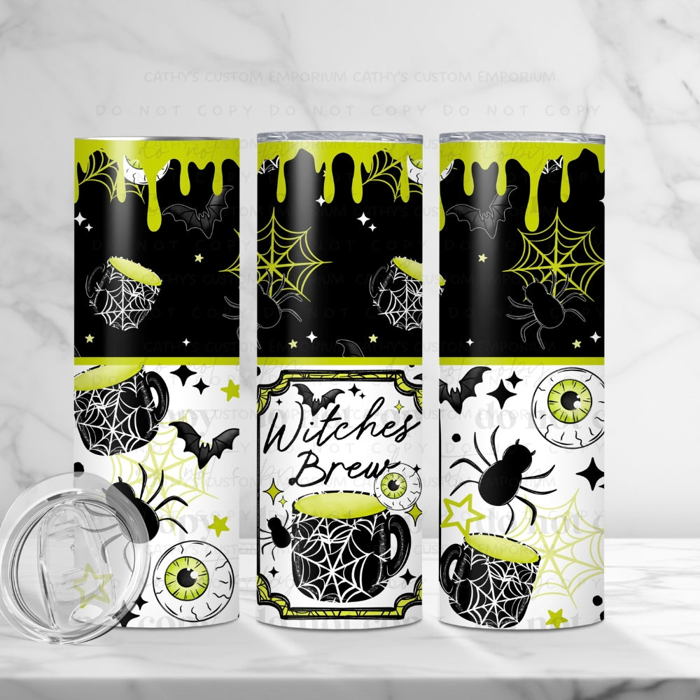 Witches Brew 20-ounce tumbler with black, white, and lime-green cauldrons, bats, spiders, webs, and eyeballs.